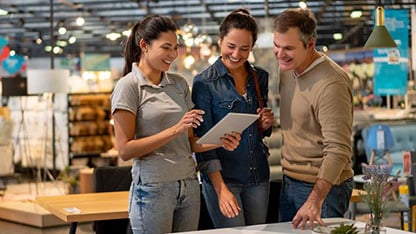 Group of consumers examining product range