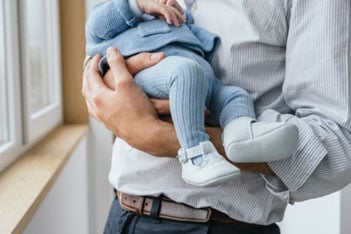 Man holding a baby