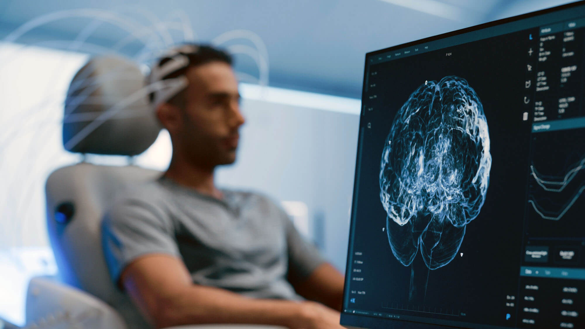 Medical Brain Scan on Computer Screen. Advanced Neuroimaging Technology Reveals Complex Neural Pathways. Patient Connected to Advanced Brain Scan in the Background