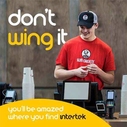 An employee wearing a Slim Chickens uniform