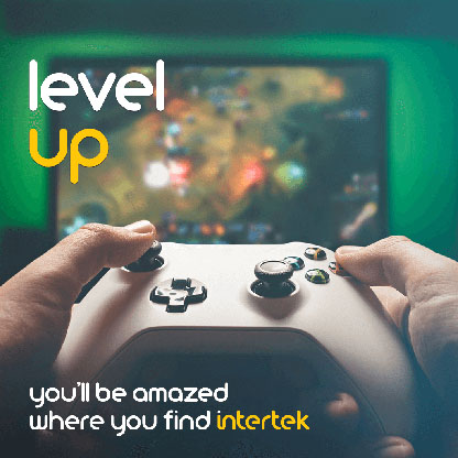 A video game controller being held in front of a TV displaying a game