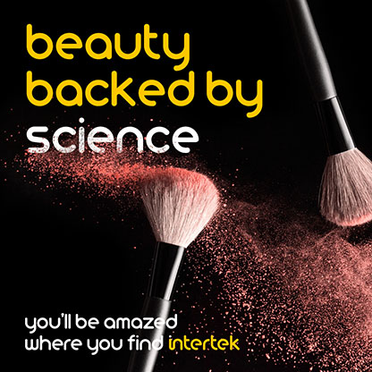 A pair of brushes moving through makeup powder