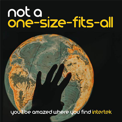 A hand silhouetteed in front of a globe