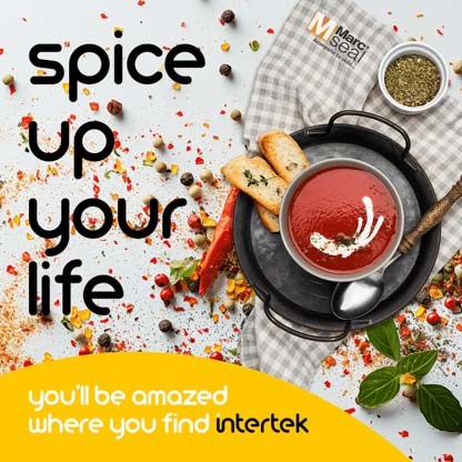 A bowl of sauce and some toast sitting alongside various spices
